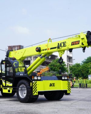 Bright yellow ACE F230 mobile crane at an industrial site in Faridabad, India.